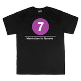 Classic Subway Tees | Black t-shirt with a blue circle featuring a white "7". Text below reads: "Manhattan to Queens." Perfect for fans of the NYC Subway Line.
