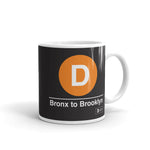 Classic Subway Logo Coffee Mugs | Ceramic mug with a orange circle featuring a white "D". Text below reads: "Bronx to Brooklyn." Perfect for fans of the NYC Subway Line.