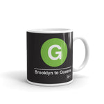 Classic Subway Logo Coffee Mugs | Ceramic mug with a light green circle featuring a white "G". Text below reads: "Brooklyn to Queens." Perfect for fans of the NYC Subway Line.