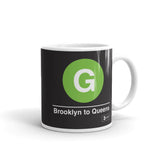 Classic Subway Logo Coffee Mugs | Ceramic mug with a light green circle featuring a white "G". Text below reads: "Brooklyn to Queens." Perfect for fans of the NYC Subway Line.