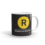Classic Subway Logo Coffee Mugs | Ceramic mug with a yellow circle featuring a black "R". Text below reads: "Queens to Brooklyn." Perfect for fans of the NYC Subway Line.