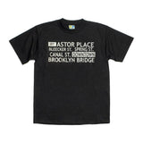 Retro Downtown Tee | Black T Shirt | NYC Subway Line | Black t-shirt featuring a retro subway roll sign design with Lower Manhattan subway stops, 100% cotton, perfect for NYC history enthusiasts.